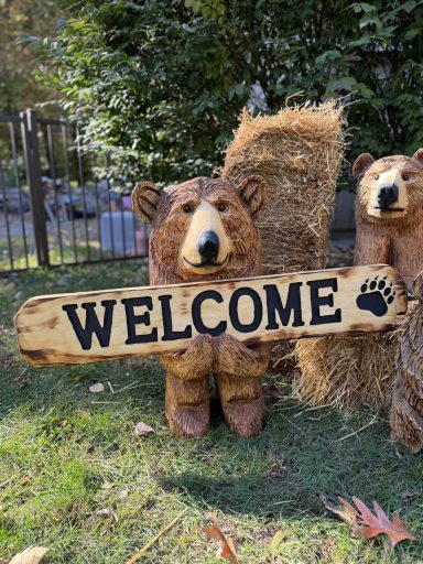 Taller version of the sign bear, with bigger sign. Natural color and varnish finish. Reversible "Welcome / Go Away" sign. All pine. Taller sign bear with bigger reversible Welcome Go Away sign, natural varnish