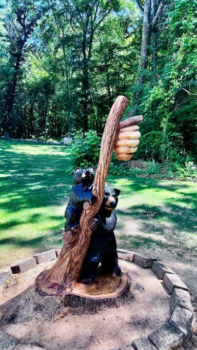 Full view of the on-site momma bear and cub, carved in place from an oak stump in Pascoag, RI. Momma bear and cub carved from an oak stump, full wide view